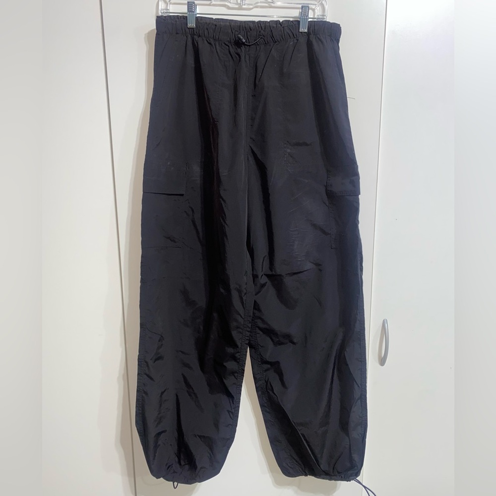 Pink Windbreaker material black pants